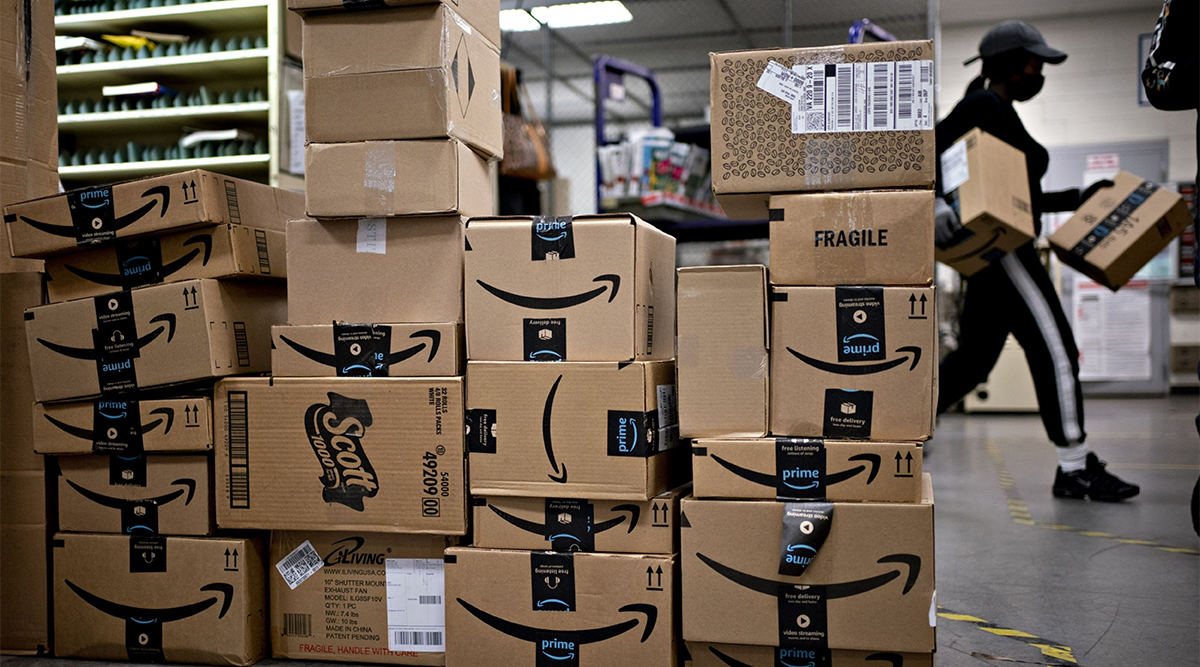 Amazon boxes sit stacked at a USPS facility in Fairfax, Va., on May 19. (Andrew Harrer/Bloomberg)