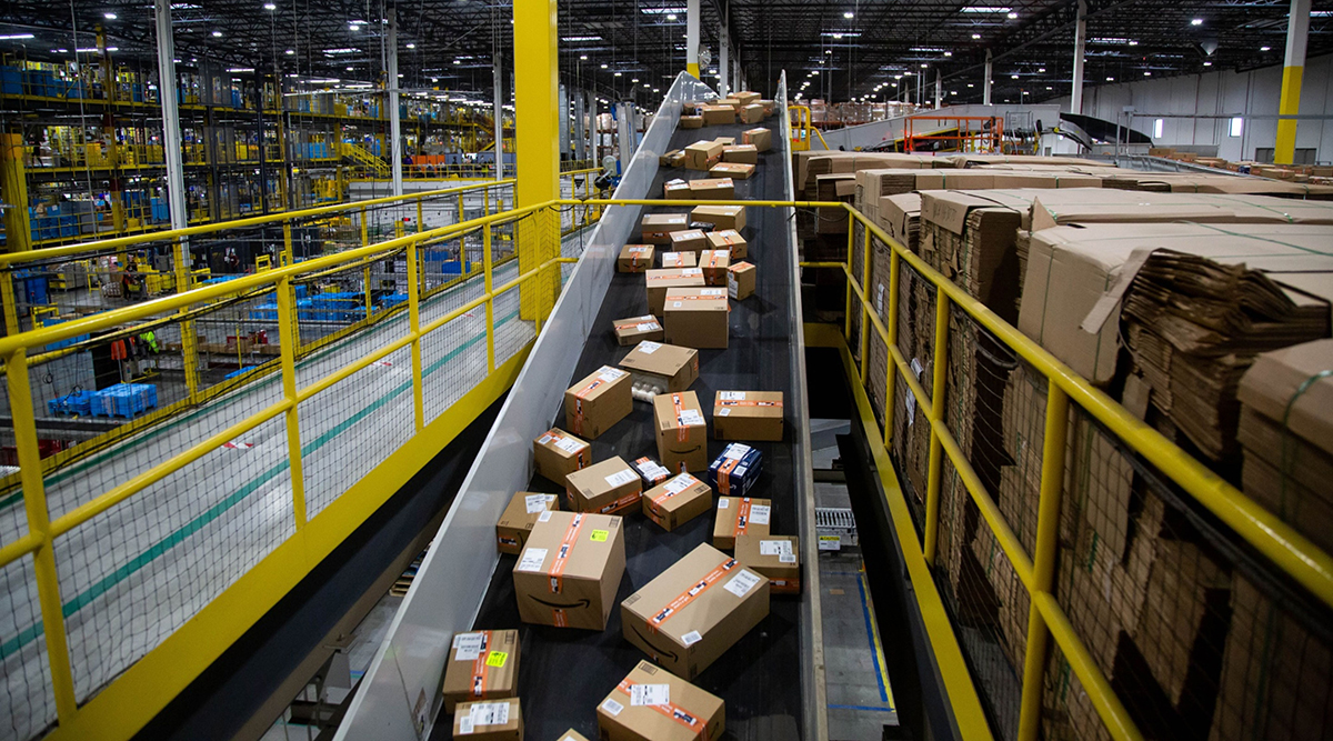 Packages move along a conveyor at an Amazon fulfillment center
