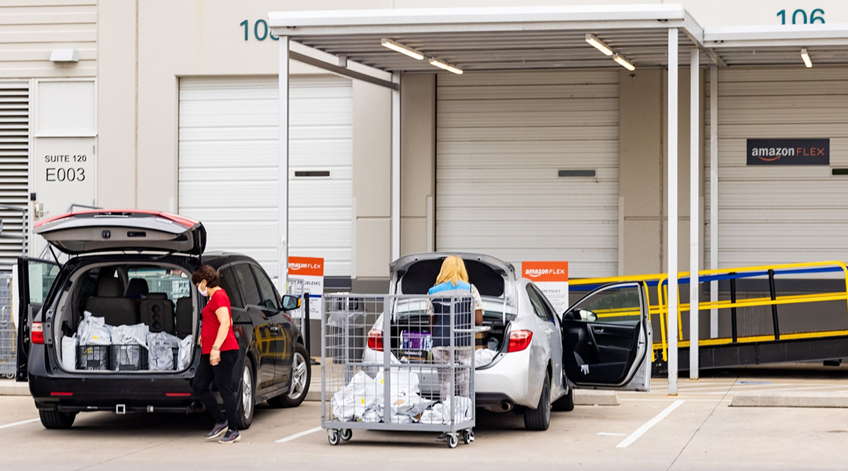  Flex workers load vehicles with orders at an Amazon delivery station in Dallas