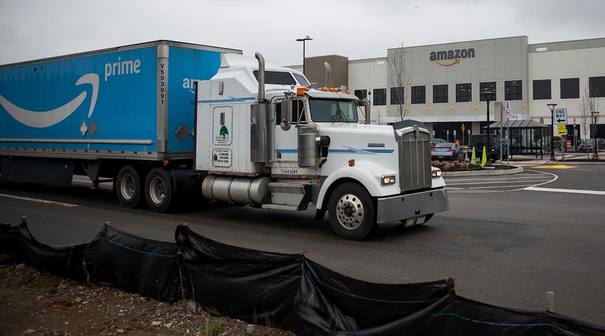 A truck passes an Amazon.com warehouse on Staten Island