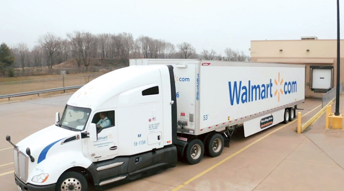 A Walmart truck driver pulls away from a distribution center