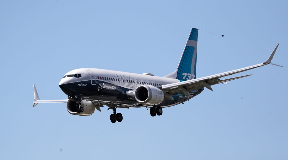 A Boeing 737 Max jet heads to a landing after a test flight in Seattle on June 29.