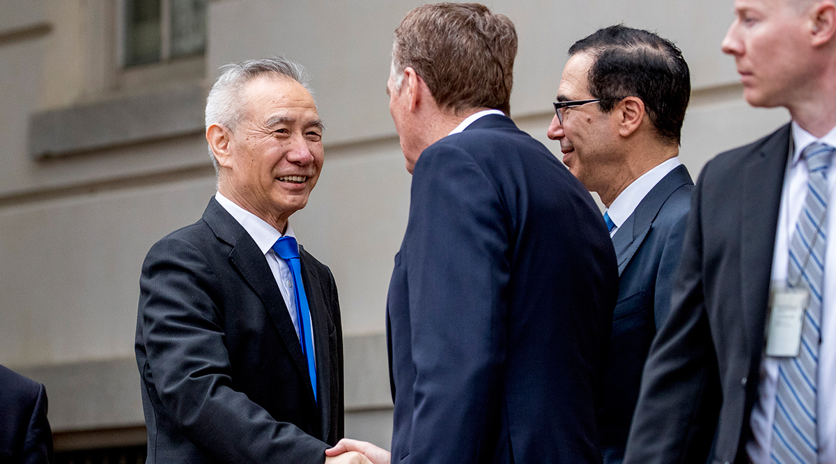 Group of American and Chinese officials greet each other