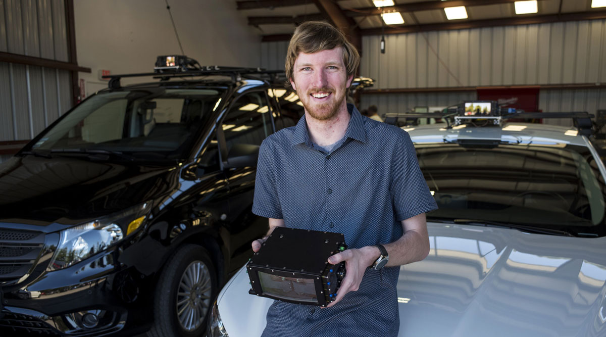 Austin Russell, founder and CEO of Luminar Technologies, holds a lidar box for a photograph.