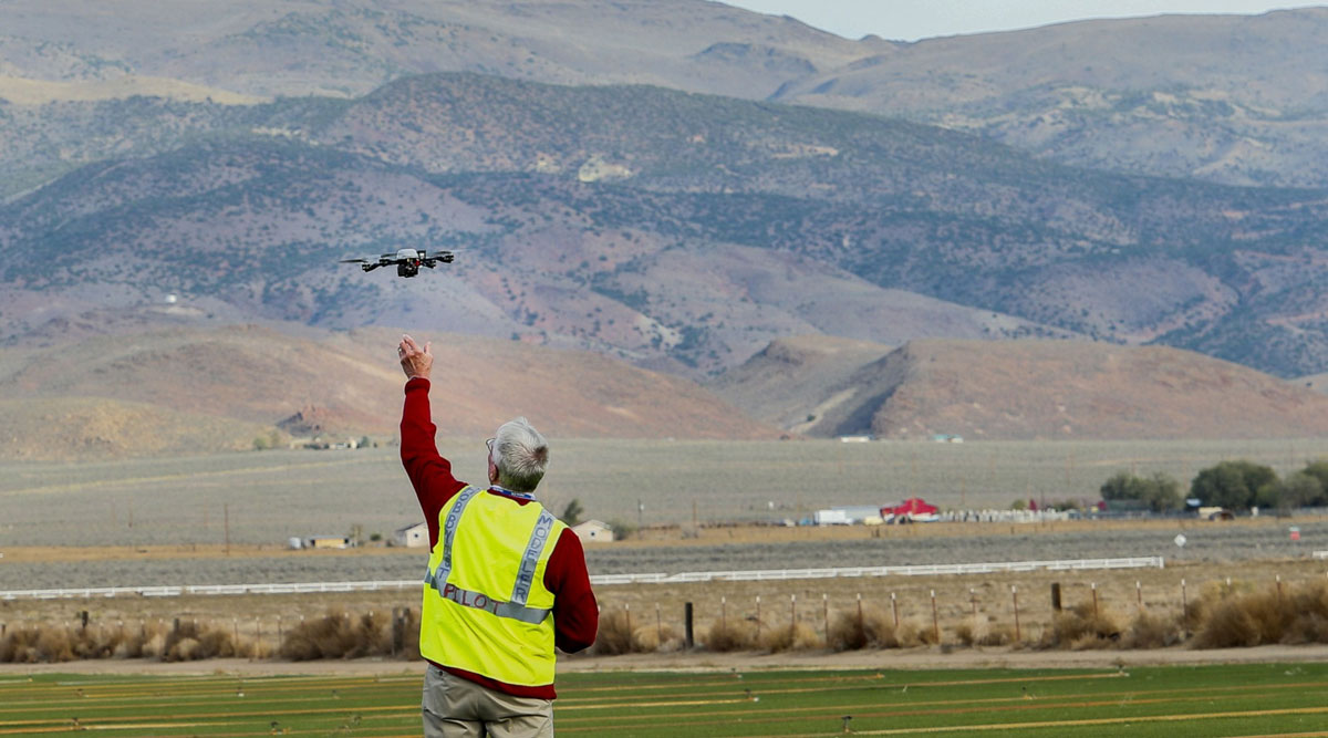 Man flies a drone.