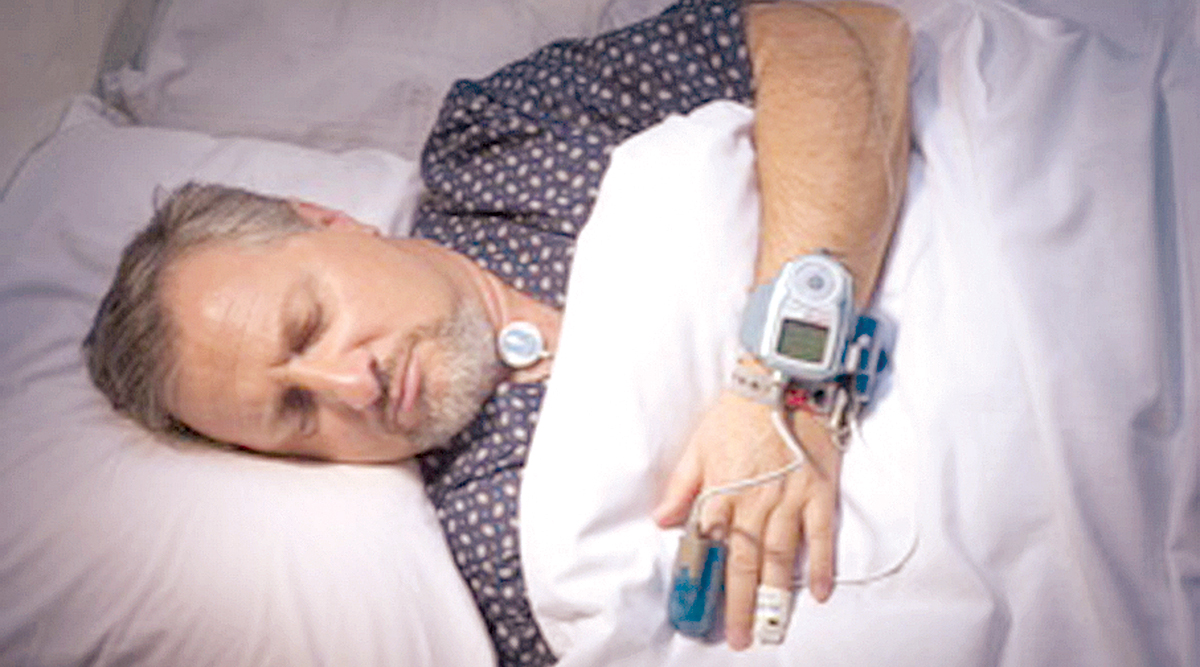 man sleeping during sleep apnea test