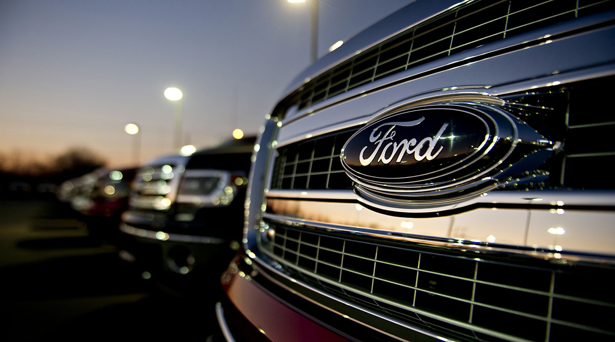 A Ford Motor Co. emblem appears on the grille of a 2014 F-150 pickup truck 