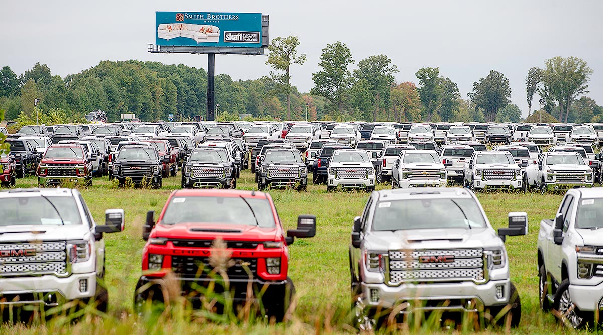 Chevrolet Silverados and GMC Sierra pickups built at Flint Assembly are parked