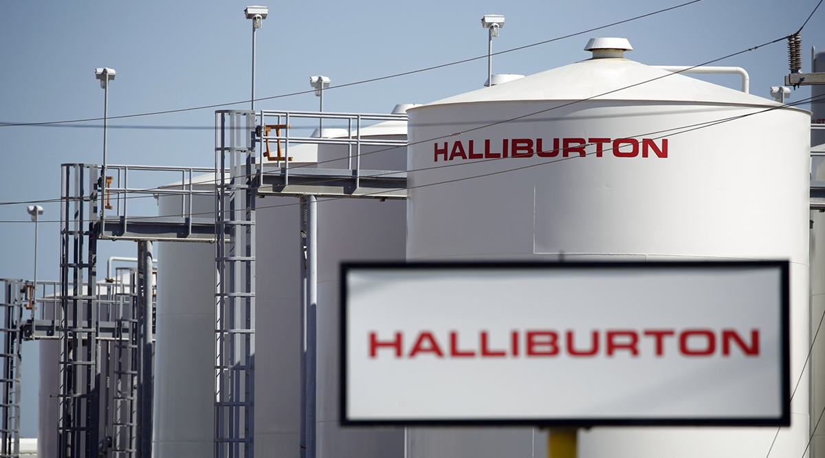 Halliburton Co. signage displayed alongside storage tanks in Port Fourchon, La.