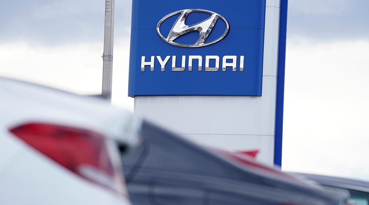 Hyundai company logo on a sign at a car dealership