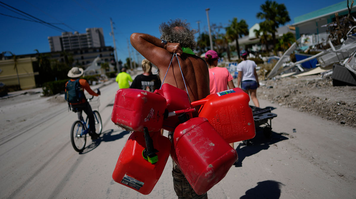 Man carrying gas containers