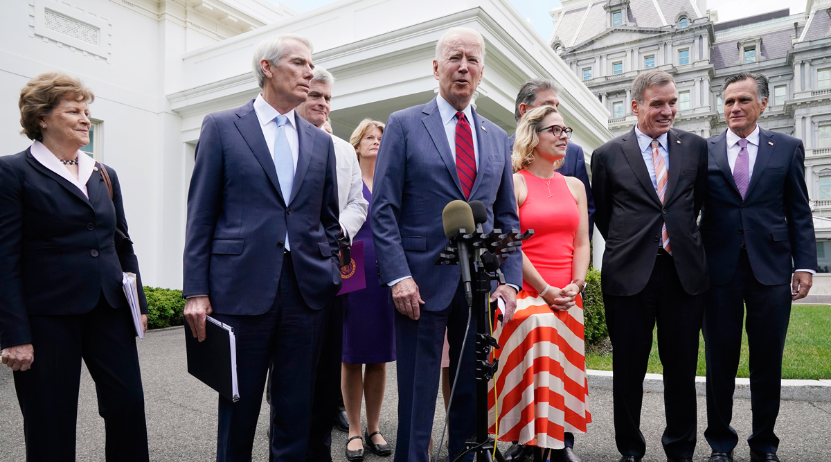 President Joe Biden, with a bipartisan group of senators, speaks June 24 outside the White House.