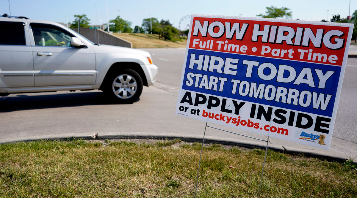 A hiring sign is displayed in Vernon Hills, Ill., on June 11. (Nam Y. Huh/Associated Press)