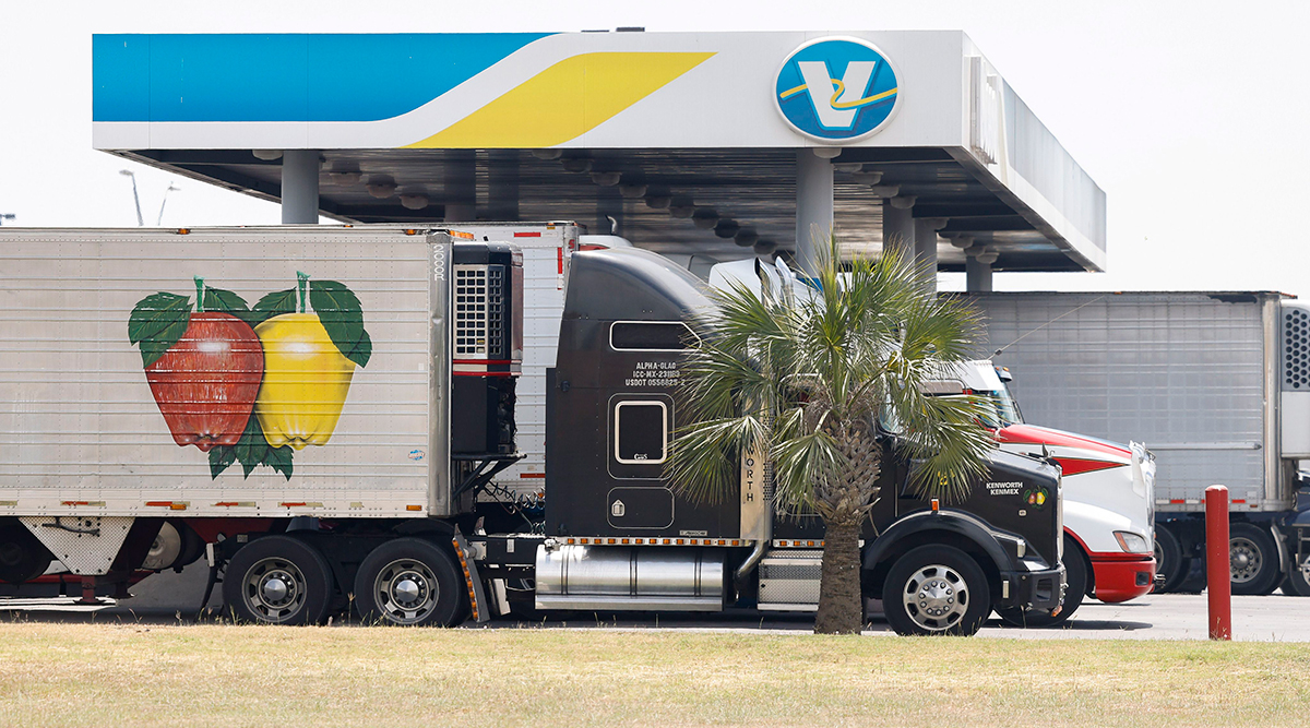 Semi-trucks sit at a rest stop near the Pharr–Reynosa International Bridge