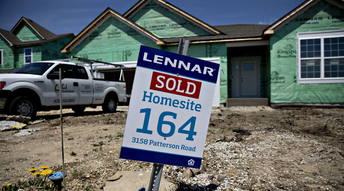 A "Sold" sign is displayed outside a home under construction in Illinois.