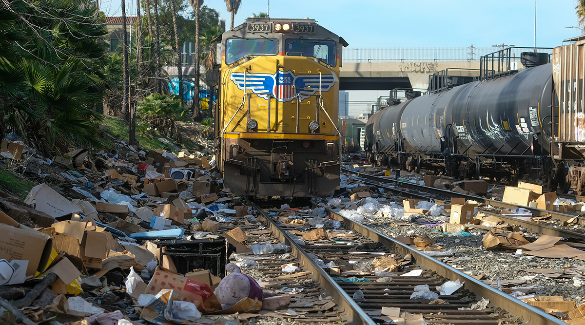 Shredded boxes and packages at a section of the Union Pacific train tracks in downtown Los Angeles