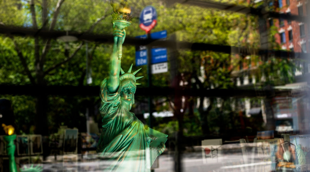 A Statue of Liberty sculpture stands on display inside a souvenir shop temporarily closed in New York on May 12.