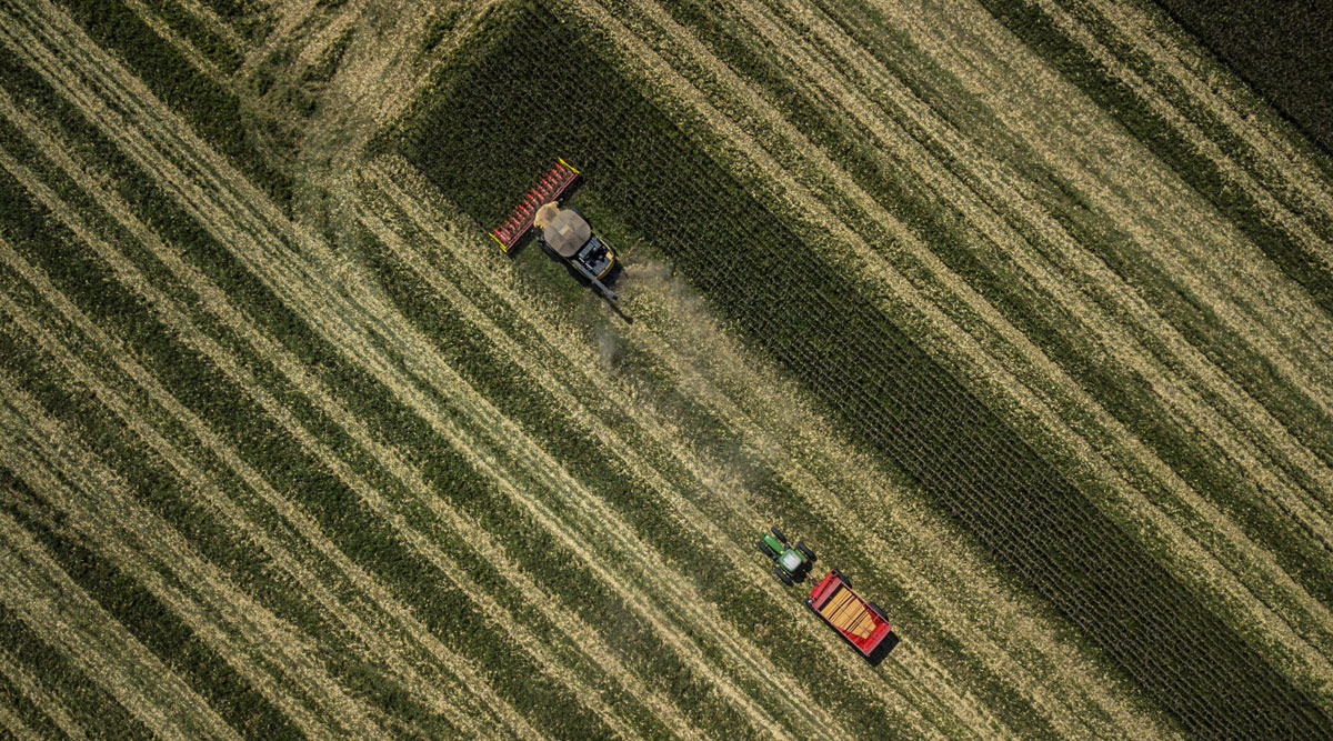 Tractors harvest corn in Brazil in May 2018.