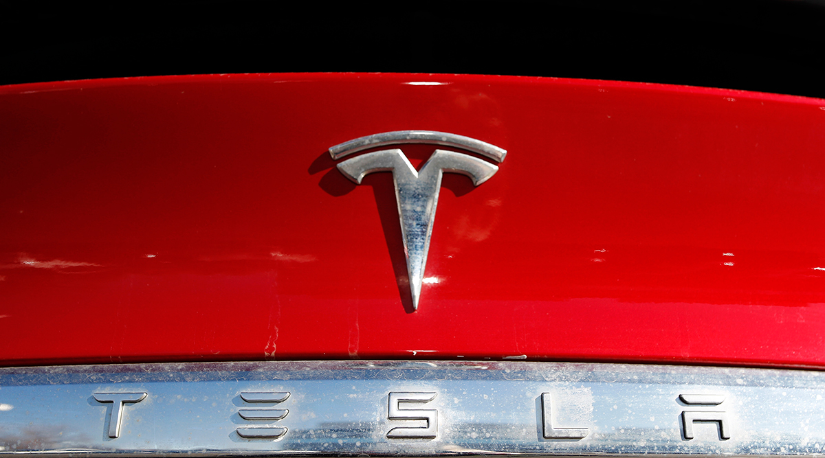 Tesla logo on an unsold 2020 Model X at a Tesla dealership in Littleton, Colo.