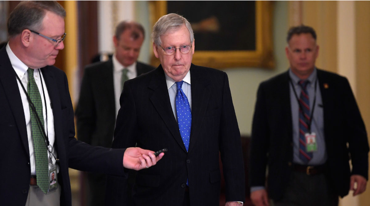 Senate Majority Leader Mitch McConnell walks back to his office in Washington on March 17.