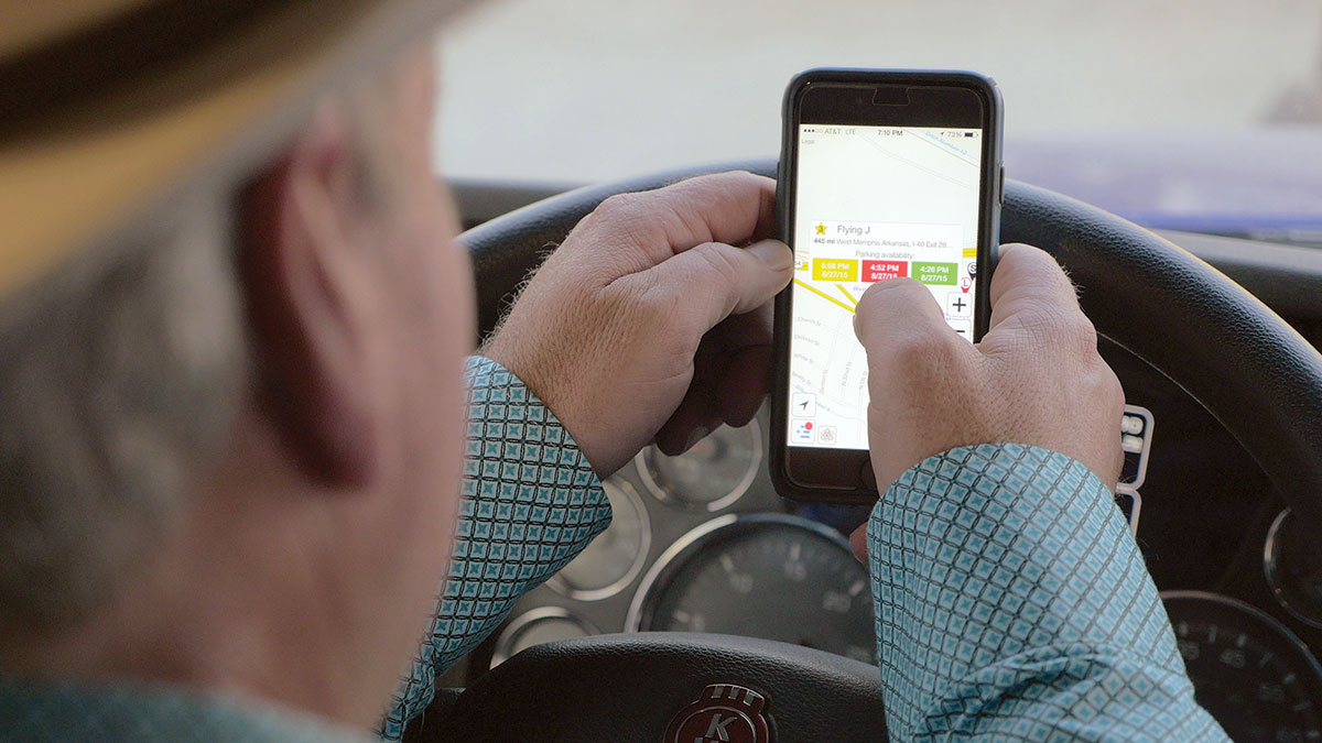 A driver uses the Trucker Path Pro mobile app