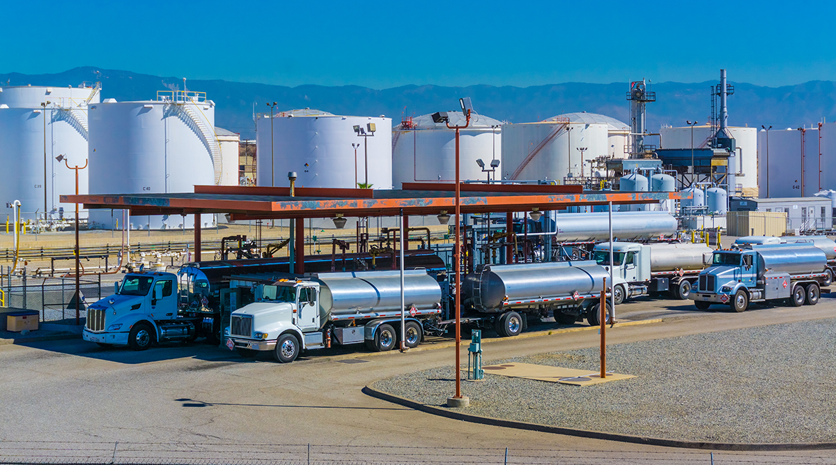 Fuel tanker trucks at a California refinery fueling station