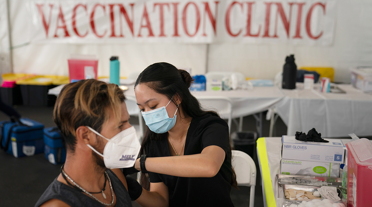 A nurse gives a vaccine to a patient in Orange, Calif.