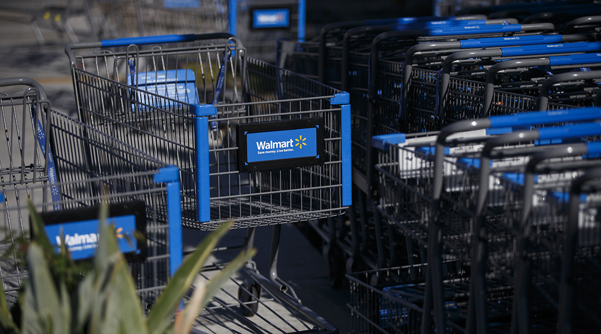 The Walmart logo is displayed on shopping carts outside a store in Burbank, Calif.