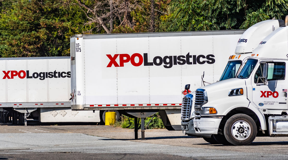 XPO Logistics tractors and trailers sit at a distribution point in San Francisco bay in July 2019.