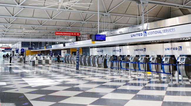 Rows of United Airlines check-in counters are seen at O'Hare International Airport.