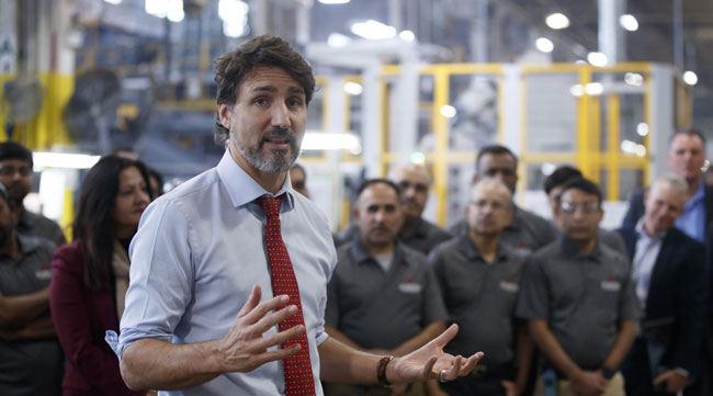 Canadian Prime Minister Justin Trudeau speaks to media at ABC Technologies in Ontario on Jan. 30.