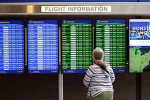 A flight information board in the Airside Terminal of Pittsburgh International Airport