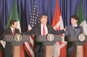 Trump reaches out to Mexico President Enrique Pena Nieto and Canadian Prime Minister Justin Trudeau.