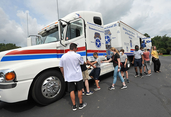 Students viewing truck