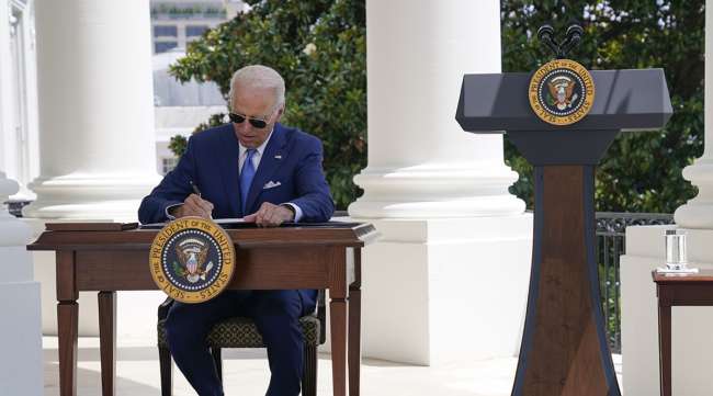 President Joe Biden signs an anti-fraud Covid-19 small business relief program bipartisan bill