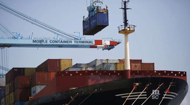 A container is loaded onto the Mediterranean Shipping Co. Pilar cargo ship at the APM Terminals yard