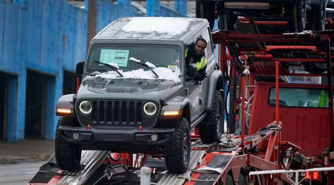 A new Jeep is delivered to a dealership