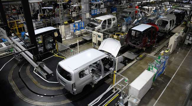 A Toyota Provox, front, and other vehicles on the production line