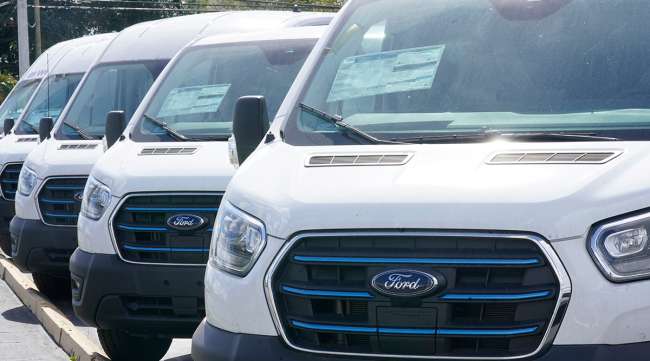 Ford E-Transit electric vans at a Ford dealership