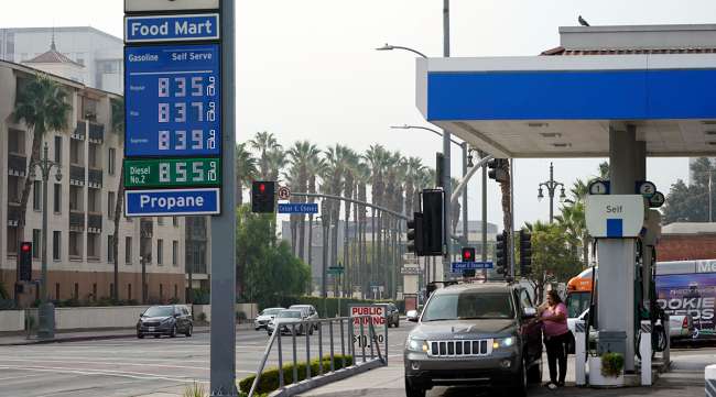 Gas prices are advertised at over eight dollars a gallon