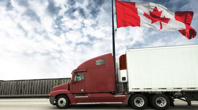 Getty image of a truck flying the Canadian flag