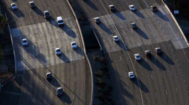 Cars move along during rush hour traffic on the US 101 Freeway