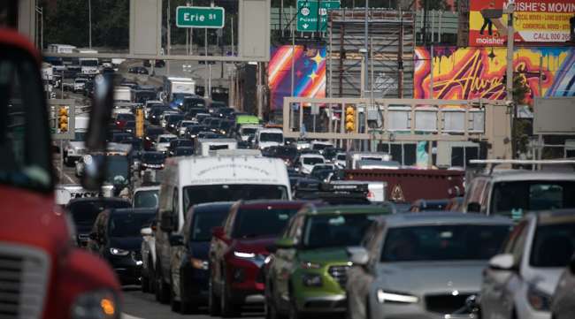 Vehicles approach the Holland Tunnel in Jersey City, N.J.