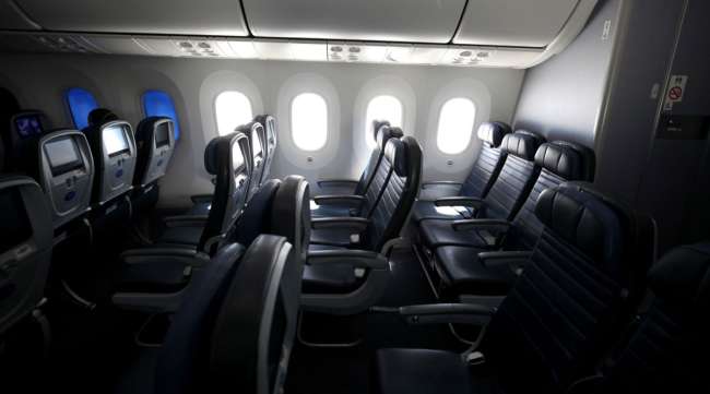 Many of the seats aboard a United Airlines flight sit empty on May 11.