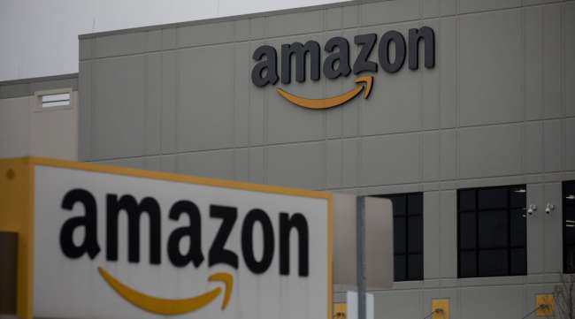 Amazon signage is displayed in front of a warehouse in Staten Island, N.Y., on March 31.
