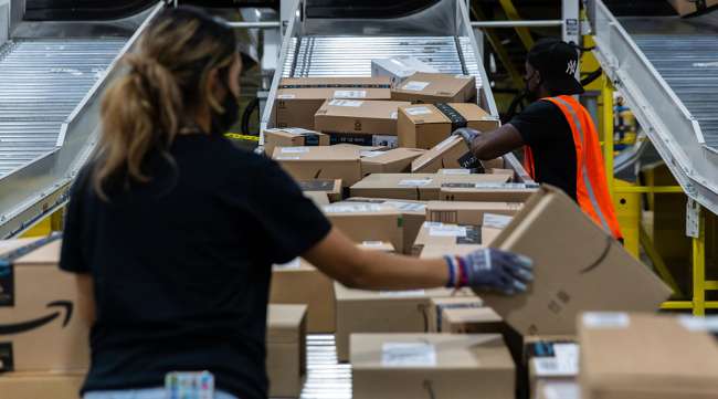 Workers retrieve boxes at an Amazon fulfillment center in Raleigh, N.C. (Rachel Jessen/Bloomberg News)