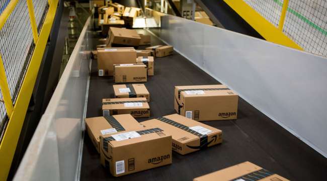Boxes move along a conveyor belt at an Amazon fulfillment center in New Jersey.