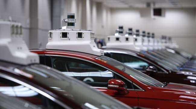 Cameras are seen on the roofs of Argo AI modified Ford Fusion autonomous vehicles in the company's headquarters in Pittsburgh.