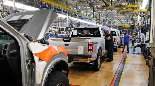 UAW assemblymen work on a 2018 Ford F-150 in September 2018.