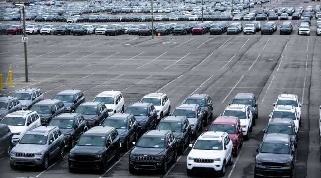 New vehicles sit parked outside the idled Fiat Chrysler Jefferson North Plant in Detroit on March 23.